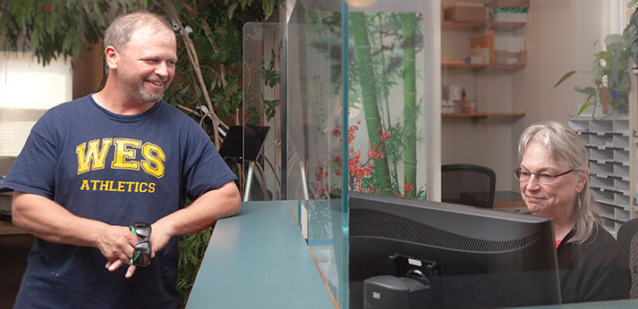 Chiropractic Amherst MA Patient at Front Desk